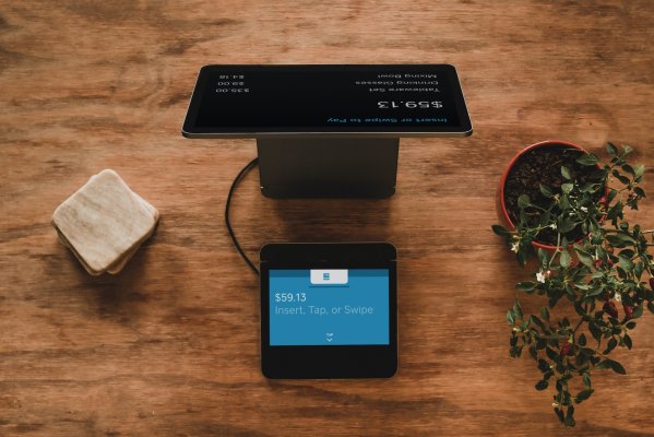 pos system setup on wood countertop